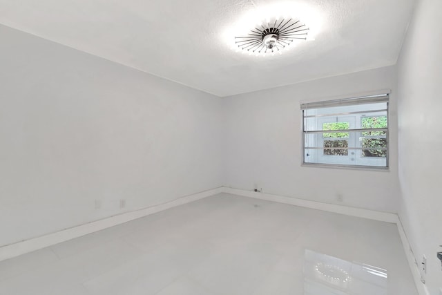 empty room featuring a textured ceiling