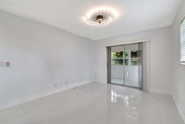 unfurnished room featuring light tile patterned flooring