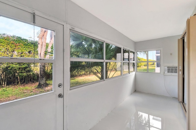 sunroom featuring plenty of natural light and cooling unit