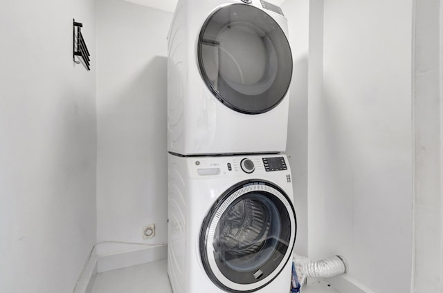 washroom with stacked washer / dryer