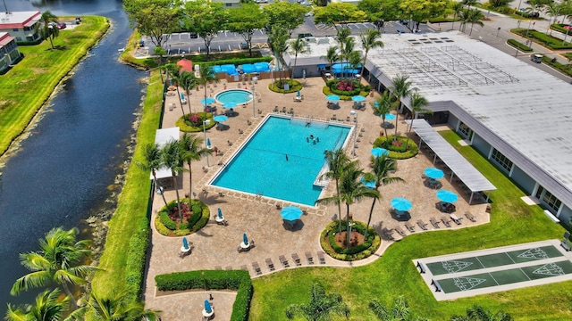 birds eye view of property featuring a water view