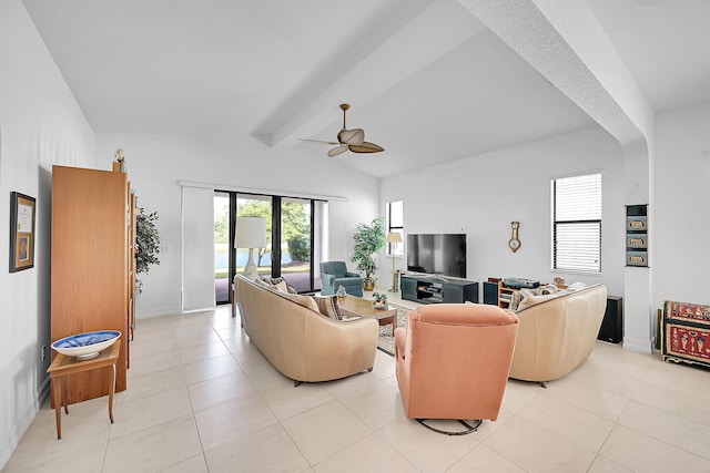 living room with light tile patterned floors, lofted ceiling with beams, and ceiling fan