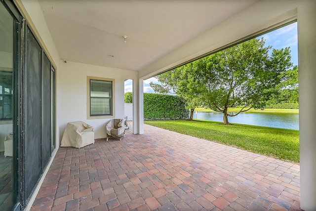 view of patio featuring a water view