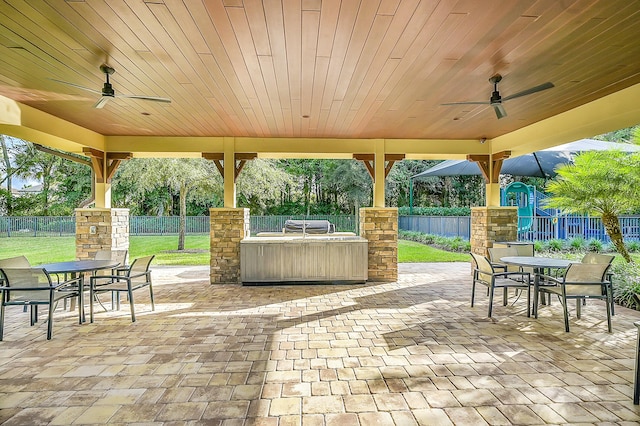 view of patio / terrace with an outdoor kitchen and ceiling fan