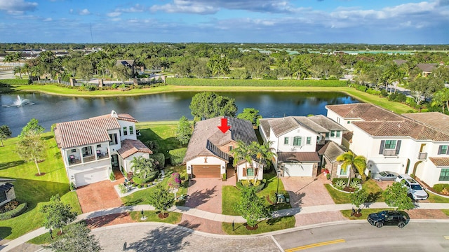 birds eye view of property with a water view