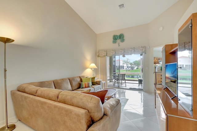 tiled living room with high vaulted ceiling