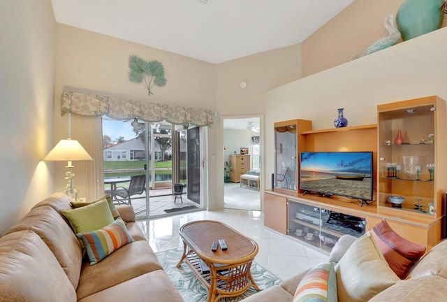 tiled living room featuring a towering ceiling