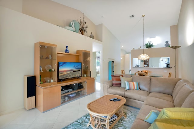 tiled living room featuring high vaulted ceiling