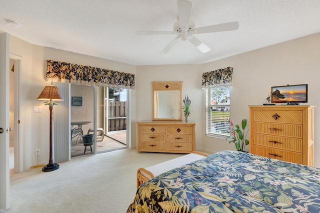 carpeted bedroom with ceiling fan, access to exterior, and multiple windows