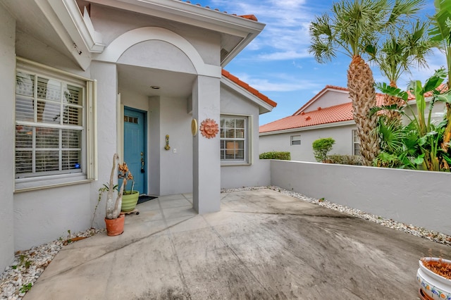 doorway to property with a patio