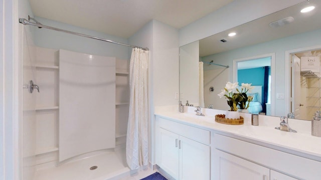 bathroom with a shower with shower curtain and vanity