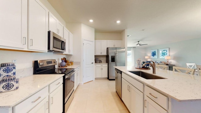 kitchen featuring white cabinetry, sink, and appliances with stainless steel finishes