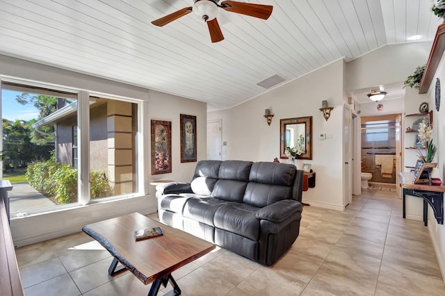 living room with ceiling fan, wooden ceiling, light tile patterned floors, and vaulted ceiling