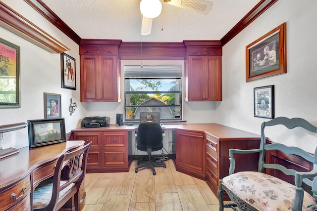 office space featuring crown molding, ceiling fan, and a textured ceiling