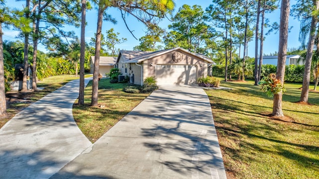 view of front facade featuring a front lawn and a garage