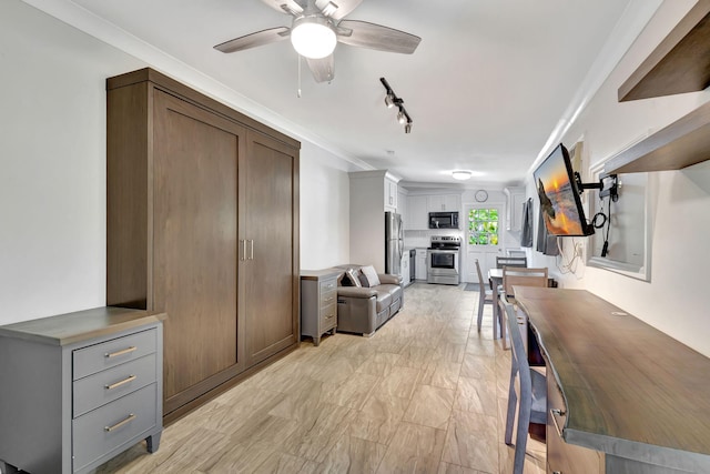 living room with ceiling fan, crown molding, and rail lighting