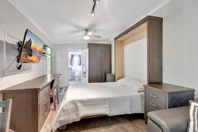 bedroom with ceiling fan, ornamental molding, ensuite bathroom, and light hardwood / wood-style flooring