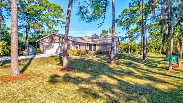 ranch-style home with a garage and a front yard