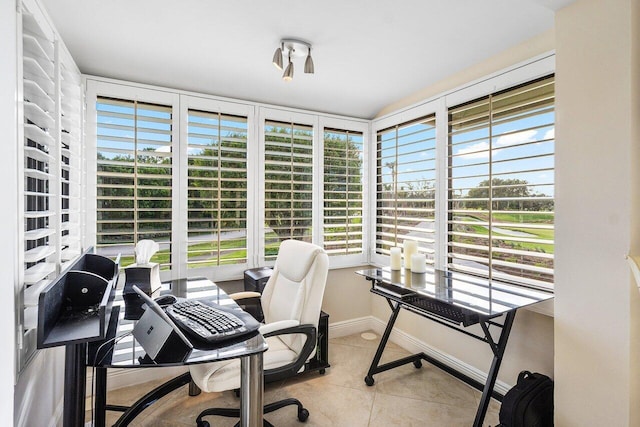 office area with light tile patterned floors and plenty of natural light