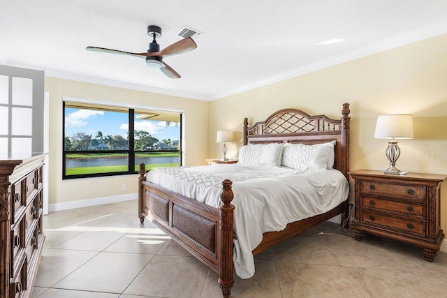 bedroom with ornamental molding, a textured ceiling, ceiling fan, light tile patterned floors, and a water view