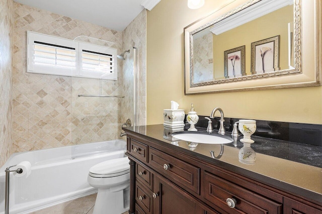 full bathroom featuring vanity, tile patterned floors, tiled shower / bath combo, and toilet