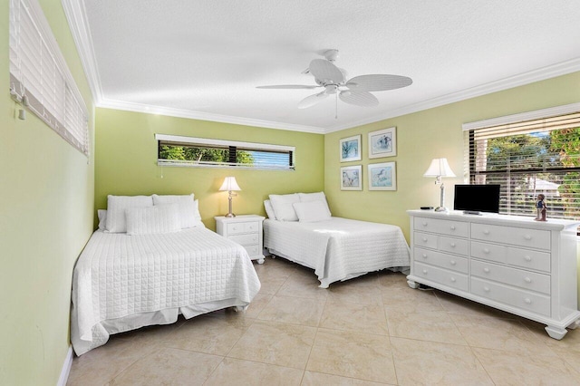 tiled bedroom featuring ceiling fan, a textured ceiling, and ornamental molding