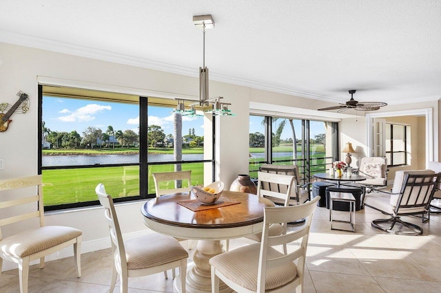 sunroom / solarium with a water view, a wealth of natural light, and ceiling fan