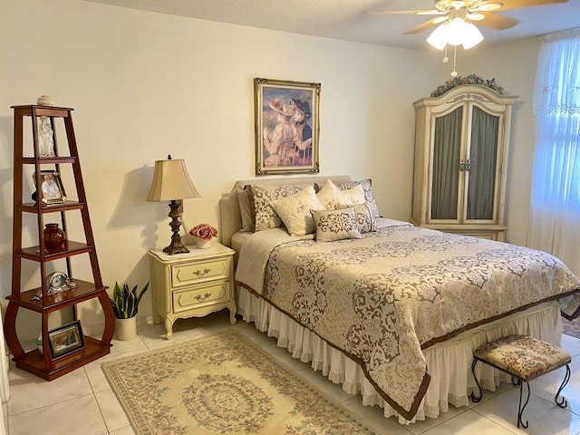 bedroom featuring ceiling fan and light tile patterned flooring