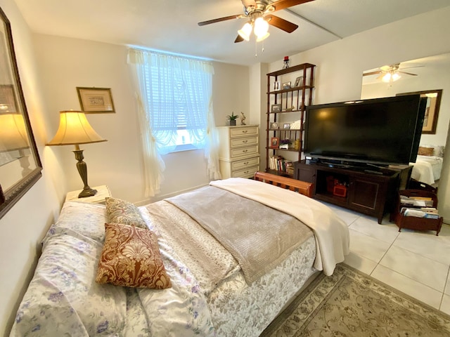 tiled bedroom featuring ceiling fan