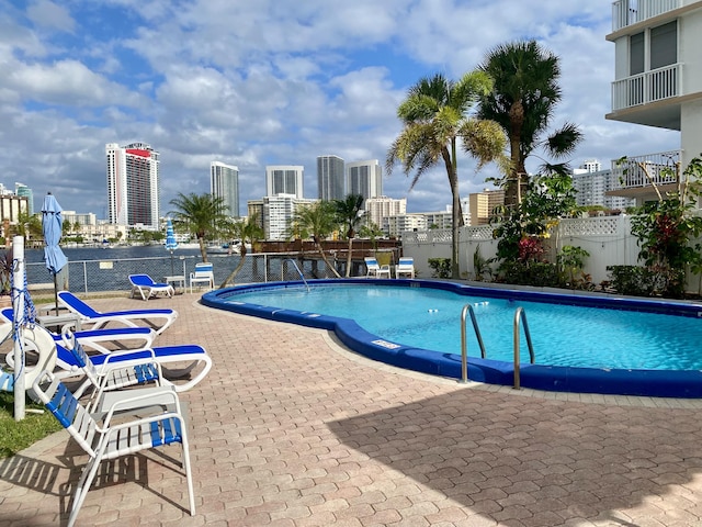 view of swimming pool with a patio area