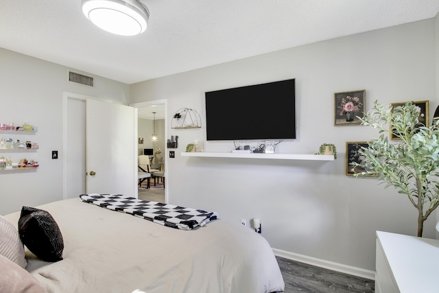 bedroom featuring dark hardwood / wood-style floors