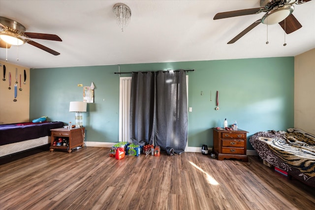 bedroom with ceiling fan and wood-type flooring