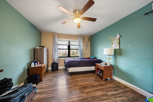 bedroom featuring ceiling fan and dark wood-type flooring