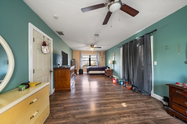 bedroom with ceiling fan and dark wood-type flooring