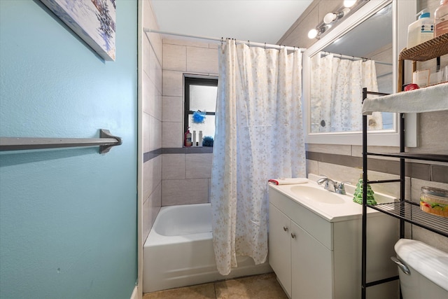 full bathroom with shower / tub combo, vanity, tasteful backsplash, and toilet