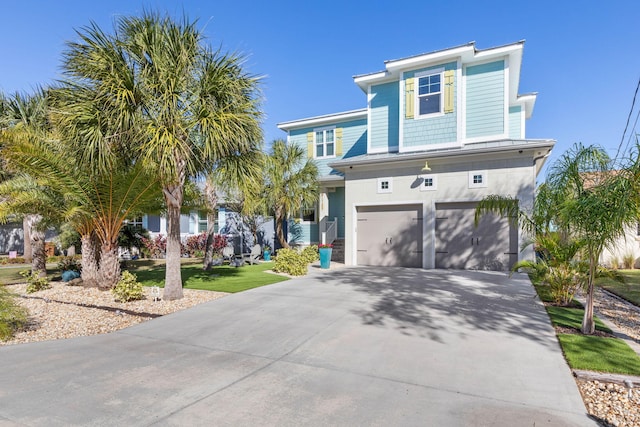 view of front facade featuring a front yard and a garage