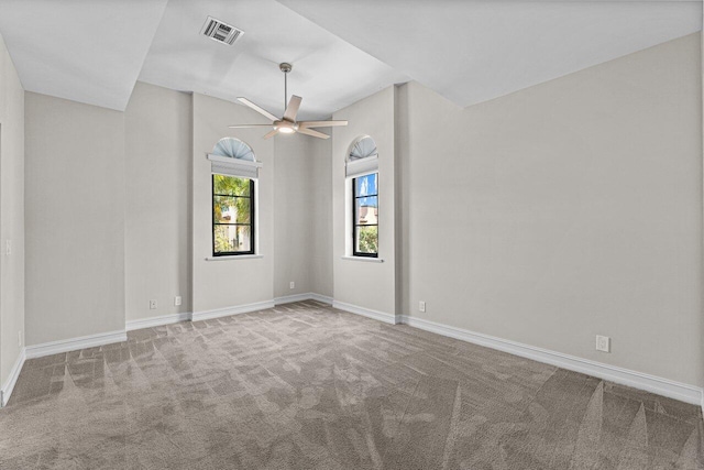 spare room featuring ceiling fan and carpet floors