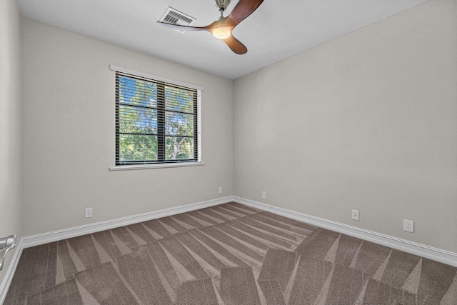 spare room with carpet flooring and ceiling fan