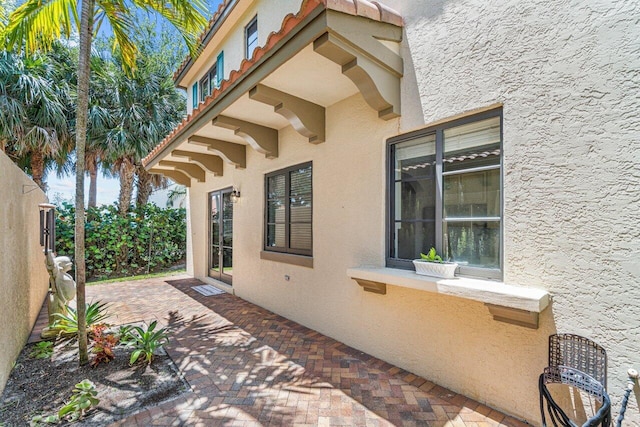 view of side of property featuring a patio area