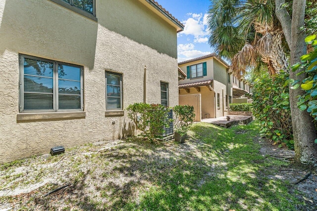 view of property exterior featuring a yard