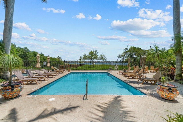 view of swimming pool with a patio