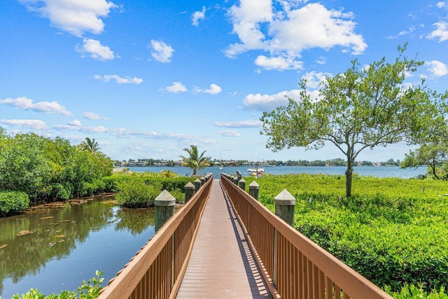 surrounding community featuring a water view