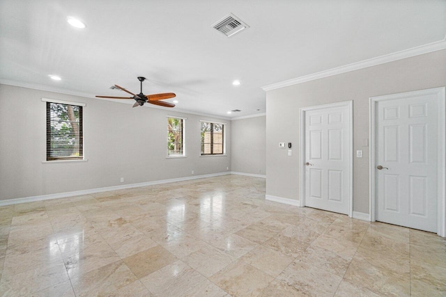 spare room with ceiling fan and ornamental molding