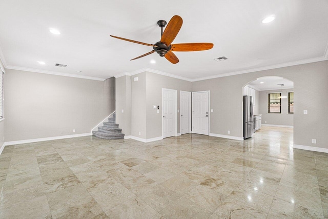 unfurnished living room featuring ceiling fan and crown molding