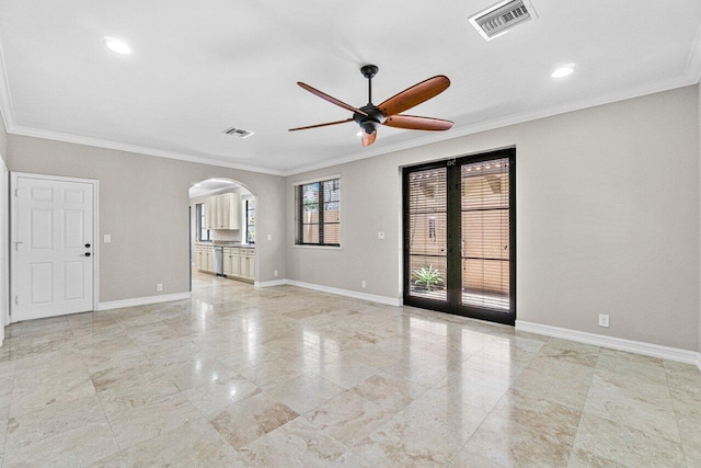 unfurnished room featuring french doors, ceiling fan, and crown molding