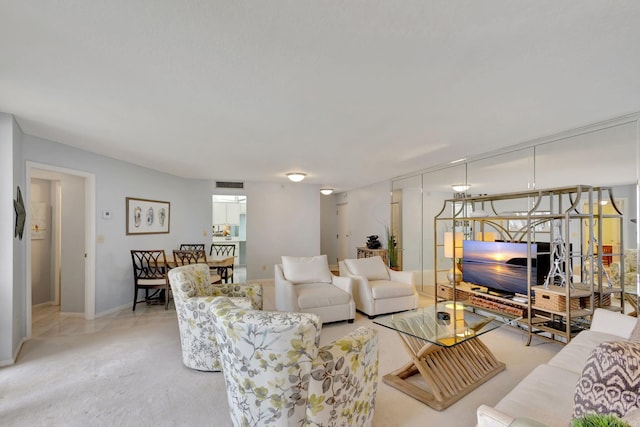 living room with light colored carpet