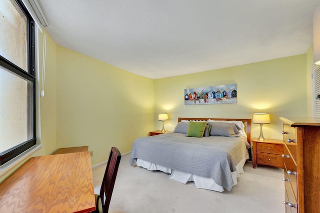 bedroom featuring light carpet