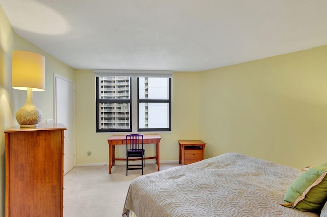 bedroom with light colored carpet