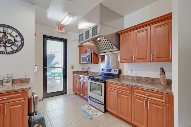 kitchen featuring light tile patterned flooring and appliances with stainless steel finishes