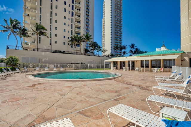 view of swimming pool with a patio area